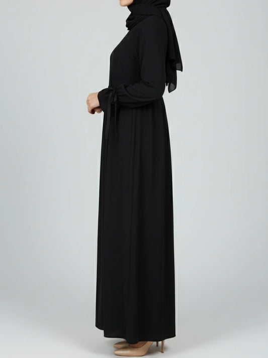 Stylish black abaya dress with matching scarf, designed in a modest abaya silhouette. Buy this ramadan abaya and other nice abayas online across Sweden, Norway, Denmark, and Canada.