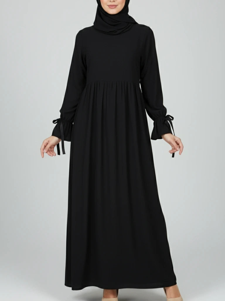Svart lång one-piece abaya-klänning med matchande sjal – perfekt som Ramadan abaya eller öppen abaya. Handla snygga abayas online i Sverige, Norge, Danmark och Kanada.