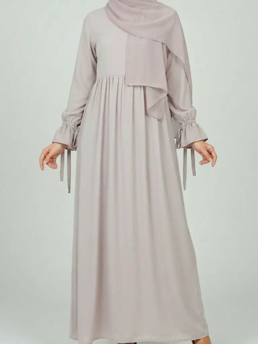 Long ligth beige modest dress with ruffled sleeves and  hijab