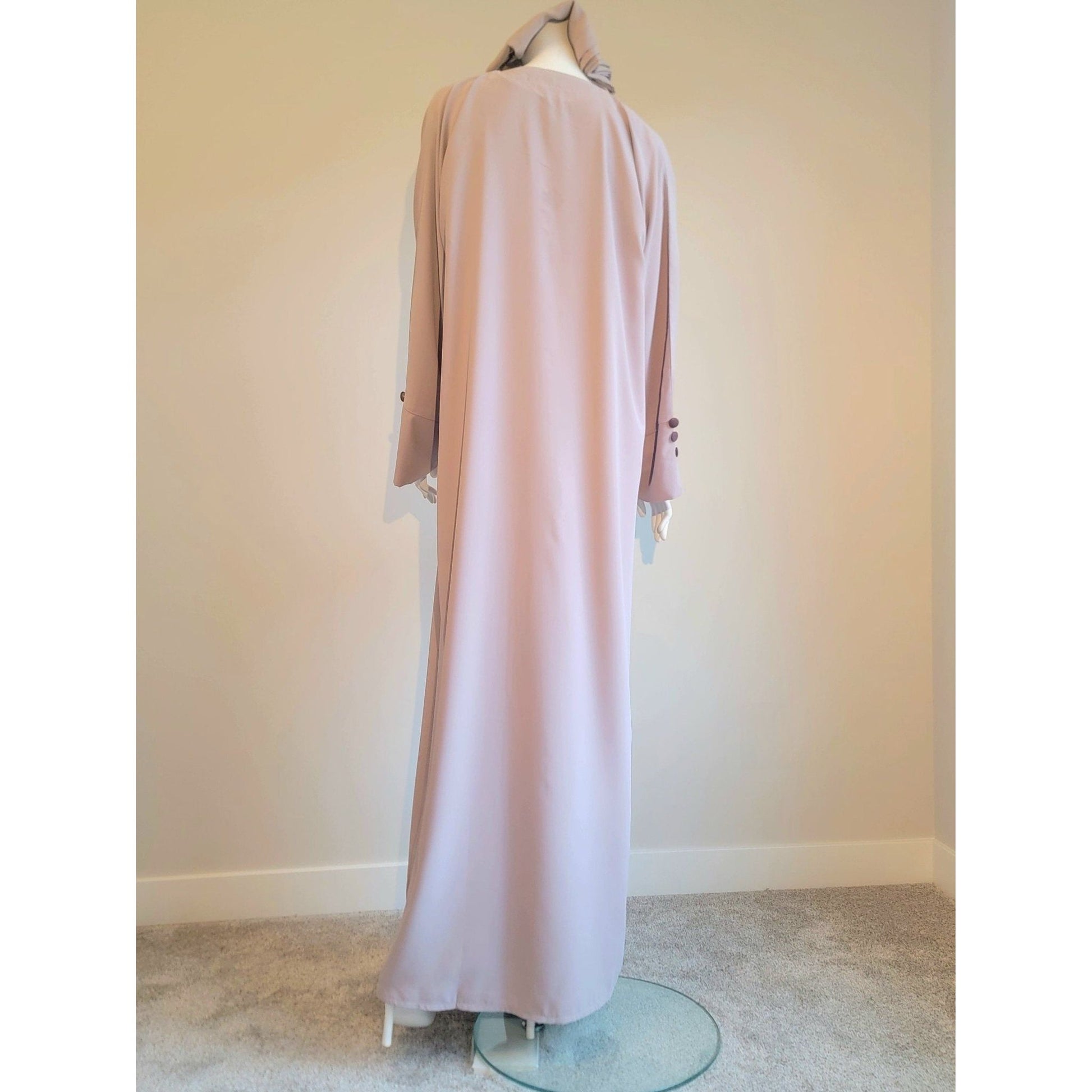 Stylish modest Muslim clothing in layered abaya style