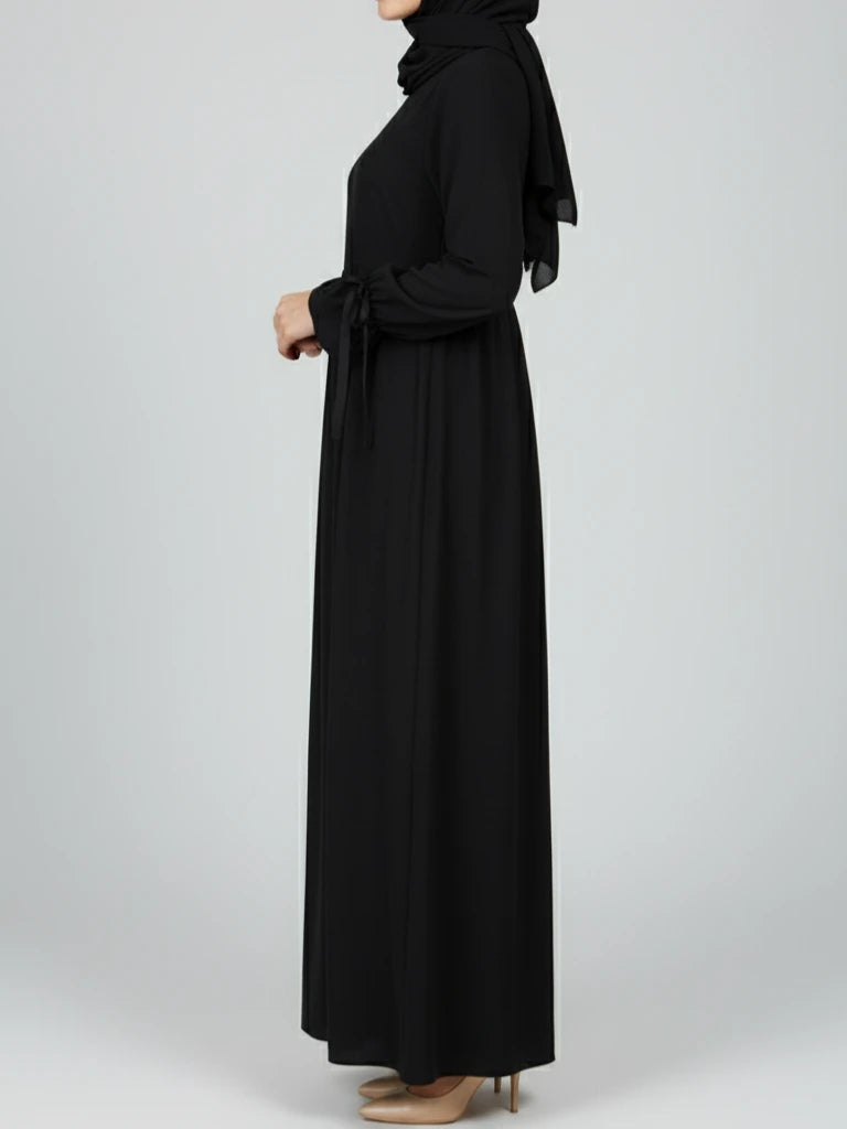 Stylish black abaya dress with matching scarf, designed in a modest abaya silhouette. Buy this ramadan abaya and other nice abayas online across Sweden, Norway, Denmark, and Canada.