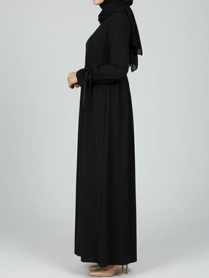 Stylish black abaya dress with matching scarf, designed in a modest abaya silhouette. Buy this ramadan abaya and other nice abayas online across Sweden, Norway, Denmark, and Canada.
