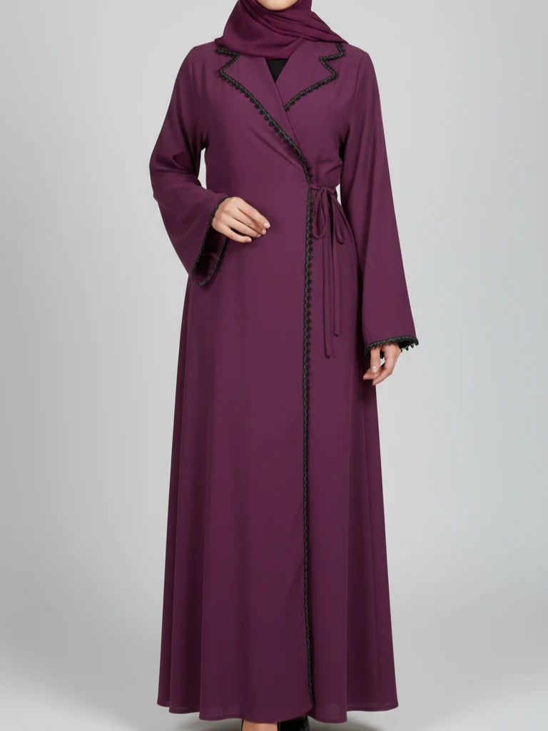 Chic modern abaya dress featuring a blazer-inspired collar, full-length stone embroidery, adjustable side ribbon closure, and matching headscarf, handmade in Dubai