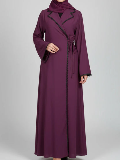 Chic modern abaya dress featuring a blazer-inspired collar, full-length stone embroidery, adjustable side ribbon closure, and matching headscarf, handmade in Dubai