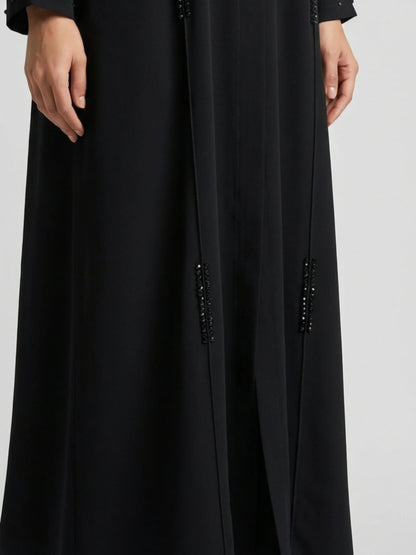 Elegant svart abaya med skimrande finish och matchande sjal