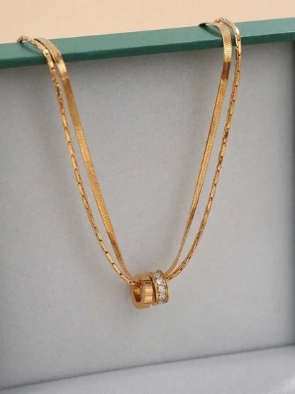 Lyxigt guldpläterat smycke i rostfritt stål med dubbelring zirkonia hänge